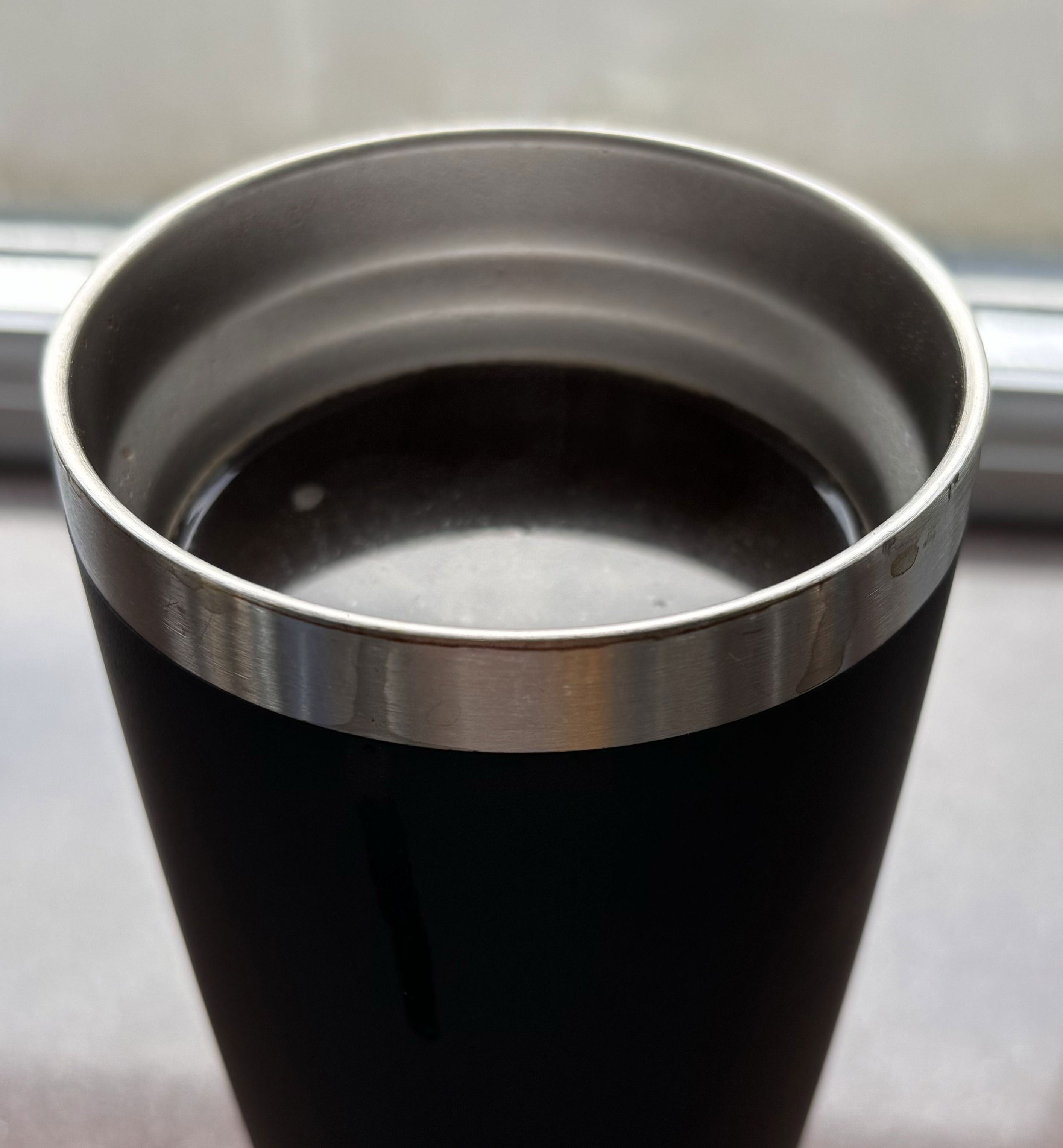 Step three. A close up shot of a hot cup of Joe.